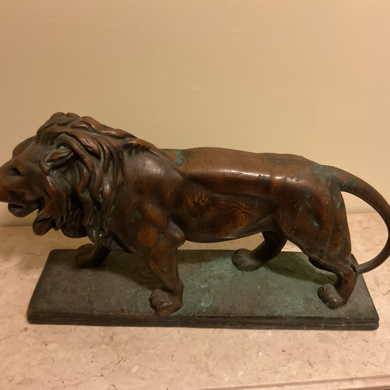 Walking Lion Sculpture With It’s Aging Patina Untouched About 21” Long.