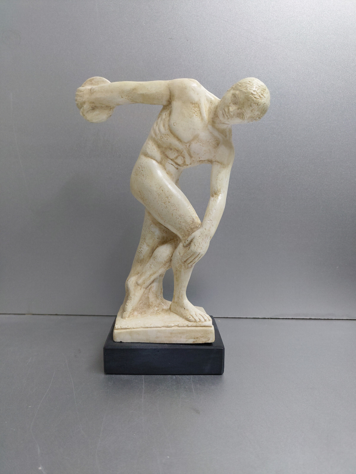 Discobolus of myron sculpture statue on black marble base
