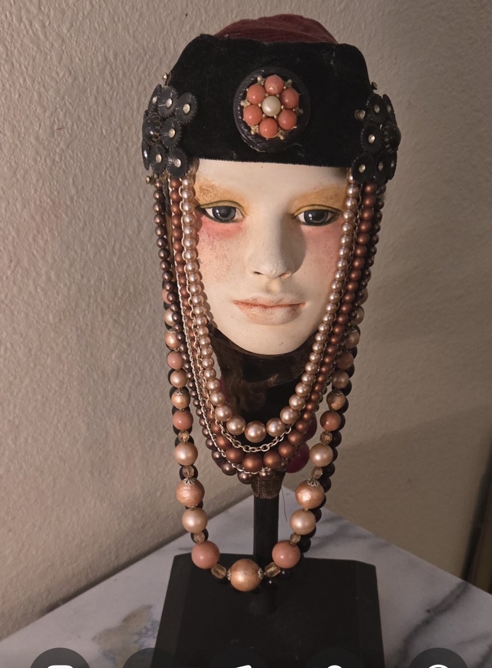 Face sculpture displayed w/ Beaded Necklaces. Collectible piece of art.