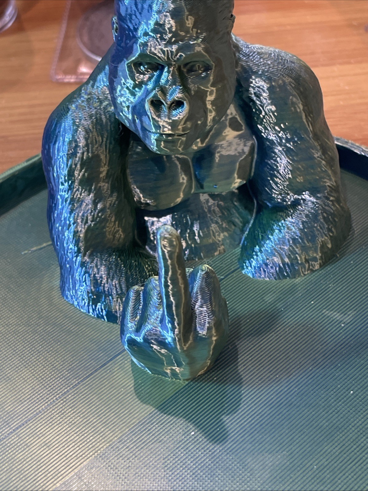Plastic Gorilla Sculpture Making Obscene Gesture Green