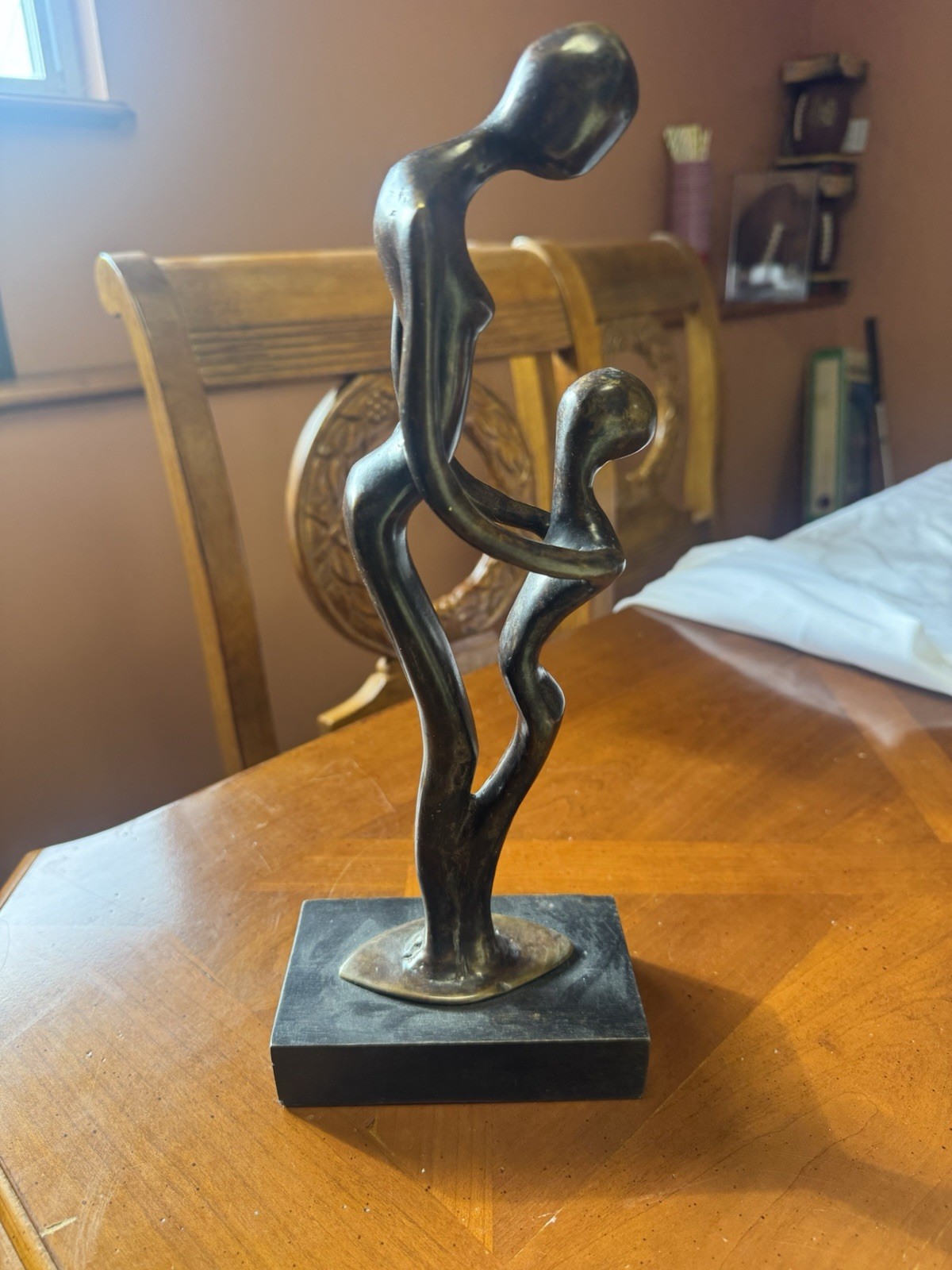 Bronze Sculpture Of Parent & Child On A Wood Base