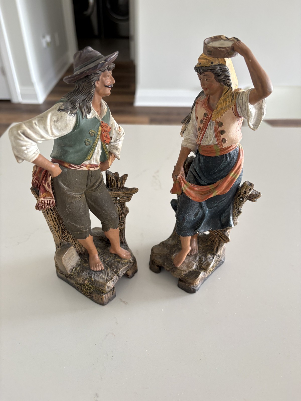 Pair of cold-painted numbered terracotta figures, may be Maresch – arm damaged
