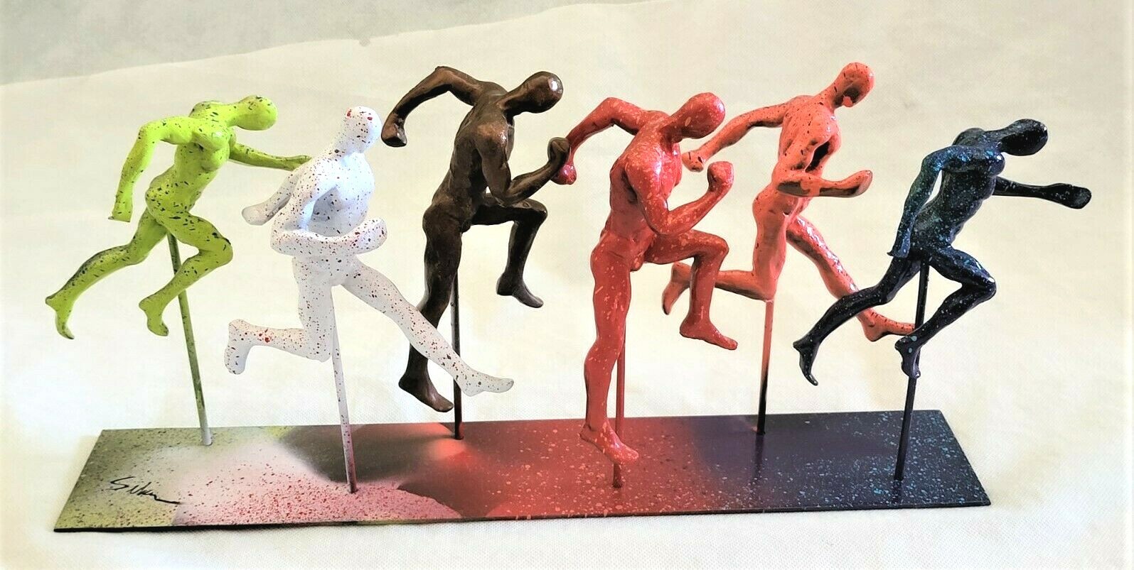Six Running Men 16&Prime; Long Metal Base Sculpture Uniquely Painted & Signed