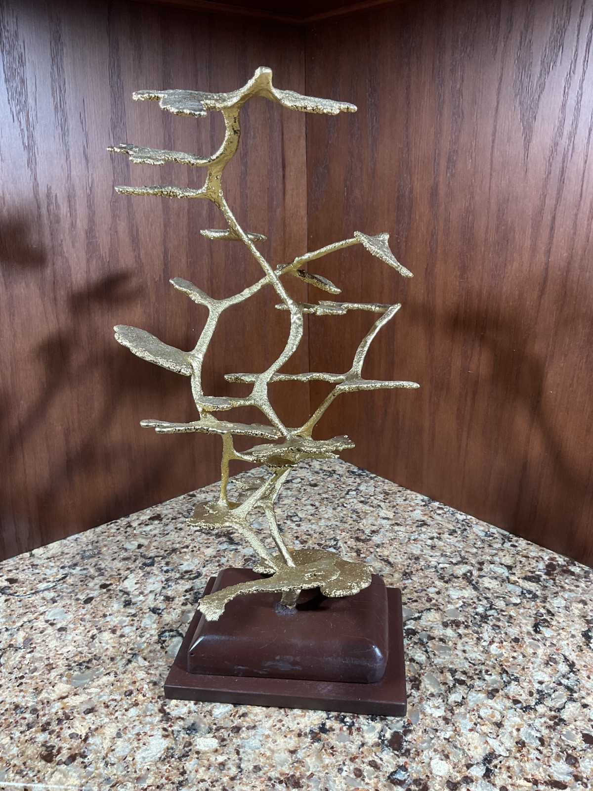 Triad, aluminum anthill sculpture on wooden base