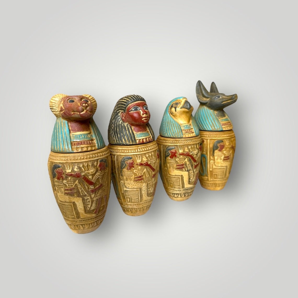 Set of four Ancient Egyptian Canopic Jars statues Hieroglyph pharaoh jars