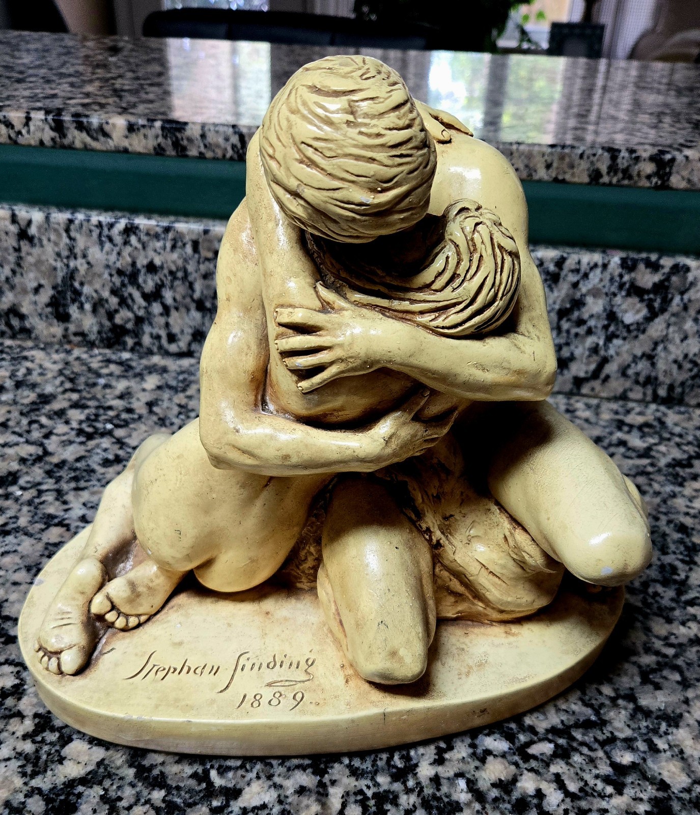 This vintage Stephan Sinding 1889 brown ceramic sculpture features two humans.